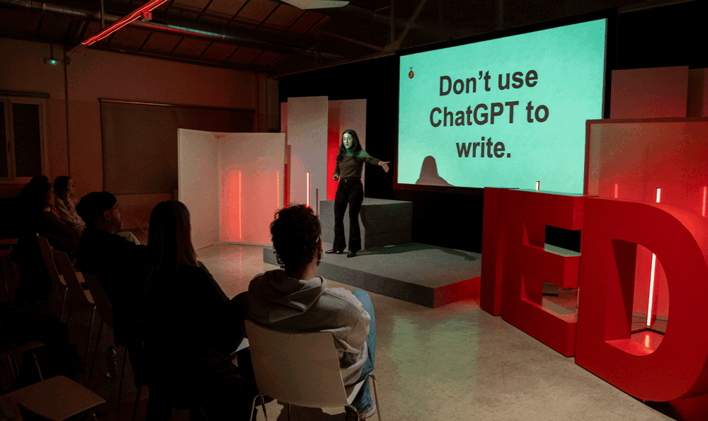 Woman giving a lecture in a room with an audience