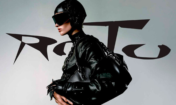 Poster for a fashion brand showing a woman with a helmet and sunglasses dressed in dark leather and the word ROTO at the top